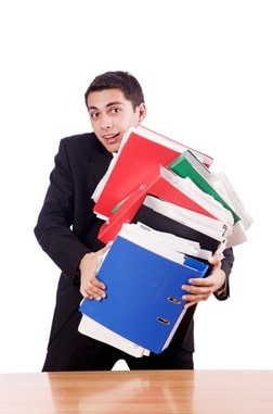 Young busy businessman at his desk Young busy businessman at his desk
