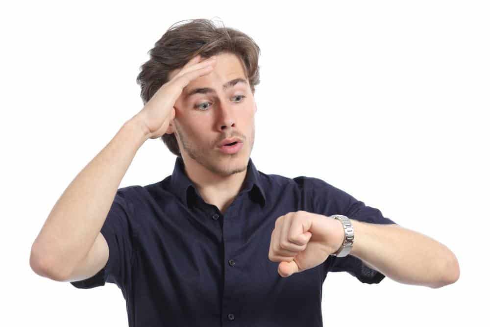 Worrier man running out of time looking his watch